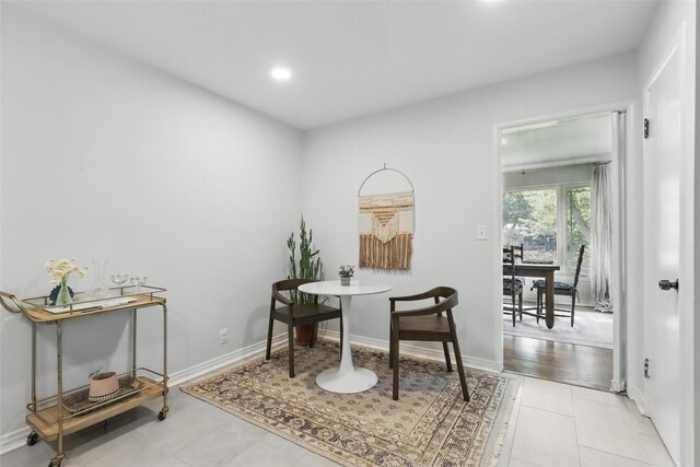 dining room featuring plenty of natural light, a fireplace, wood finished floors, and recessed lighting