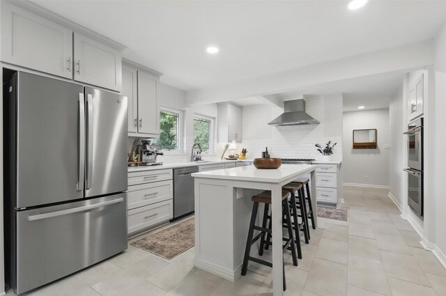 dining space with tile patterned flooring, recessed lighting, and baseboards
