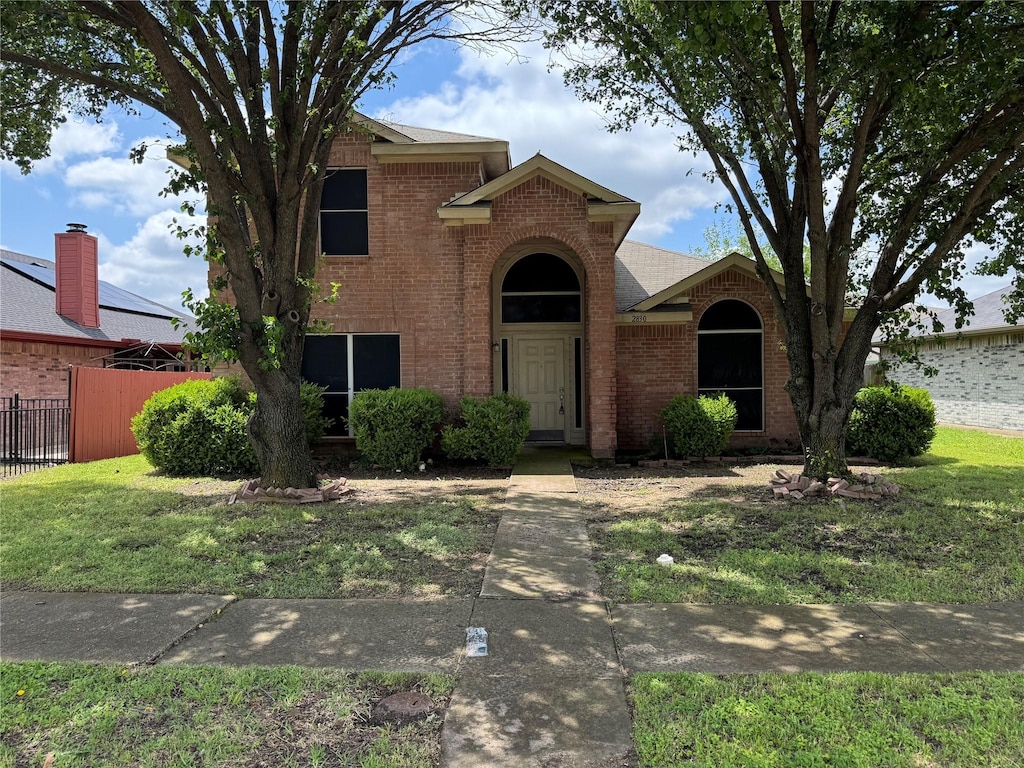 traditional home with brick siding