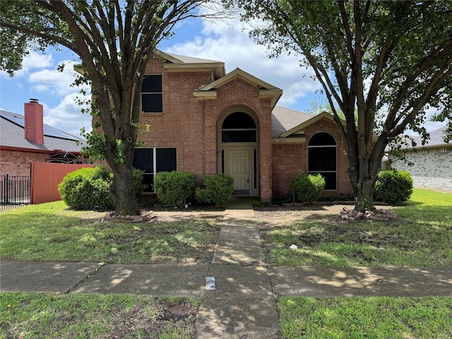traditional home with brick siding