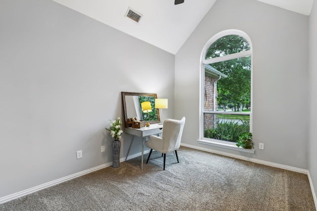 carpeted office featuring lofted ceiling, baseboards, and a ceiling fan