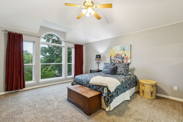 bedroom with vaulted ceiling, carpet flooring, a ceiling fan, and baseboards