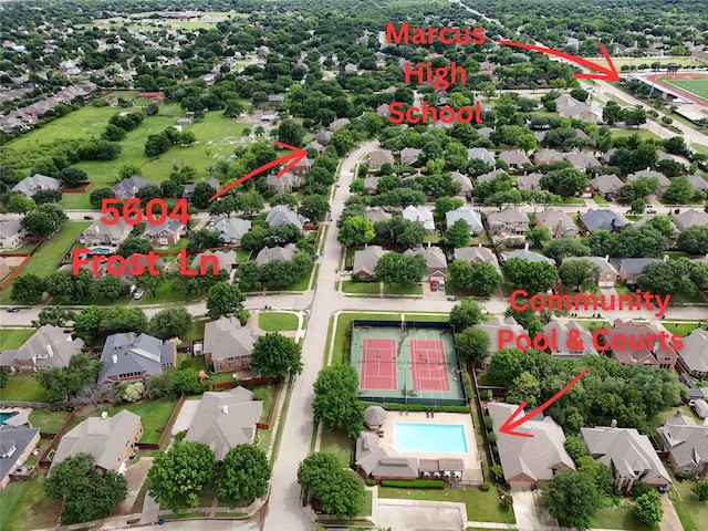 aerial view of residential area featuring a pool