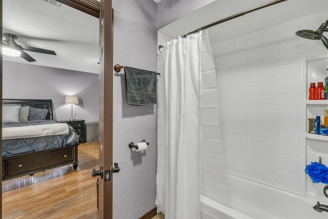 bathroom featuring connected bathroom, a ceiling fan, shower / bath combination with curtain, and wood finished floors