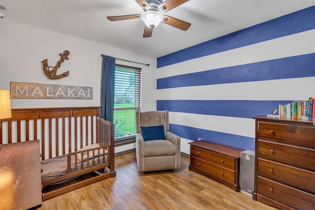 bedroom with wood finished floors and ceiling fan
