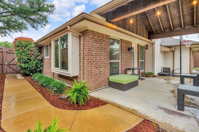 view of patio / terrace featuring fence
