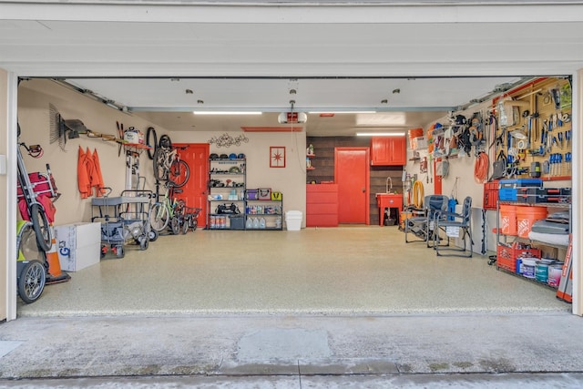 garage with a workshop area and a garage door opener