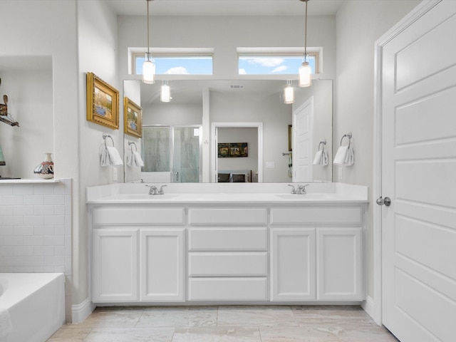 2209 Trace Ridge Dr, Weatherford, TX 76087 - bathroom featuring a shower stall, double vanity, and a bath
