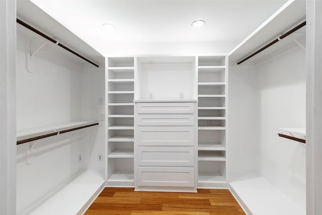 spacious closet featuring light wood-style flooring