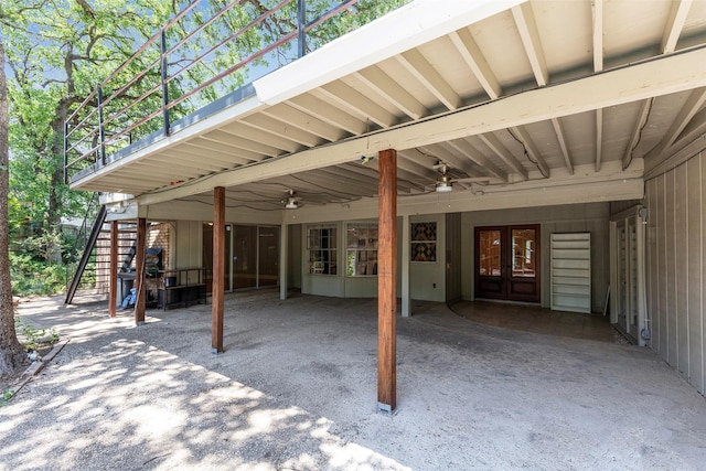 view of patio / terrace featuring stairway, french doors, a carport, and ceiling fan
