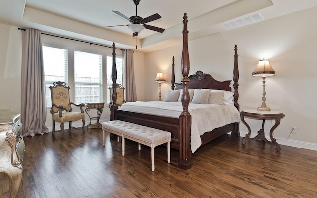 4625 Man O War Rd, Carrollton, TX 75010 - bedroom with a raised ceiling, dark wood-style flooring, baseboards, and a ceiling fan