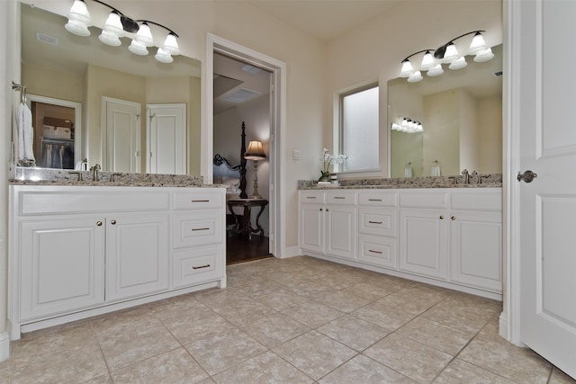 4625 Man O War Rd, Carrollton, TX 75010 - ensuite bathroom featuring vanity and tile patterned flooring