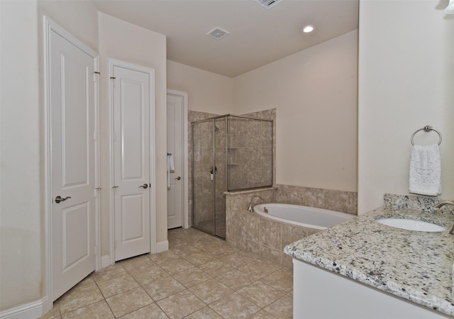 4625 Man O War Rd, Carrollton, TX 75010 - bathroom with a stall shower, a bath, tile patterned floors, vanity, and recessed lighting