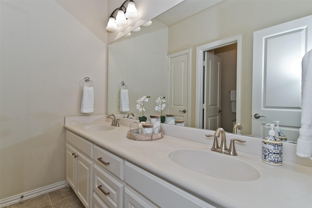 4625 Man O War Rd, Carrollton, TX 75010 - bathroom featuring tile patterned floors, double vanity, and baseboards