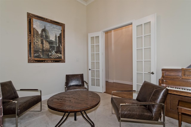 4625 Man O War Rd, Carrollton, TX 75010 - living area featuring french doors, baseboards, crown molding, and carpet