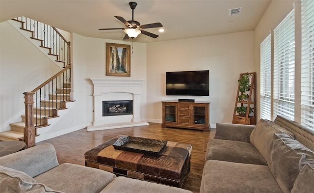 4625 Man O War Rd, Carrollton, TX 75010 - living area featuring wood finished floors, ceiling fan, plenty of natural light, stairs, and recessed lighting