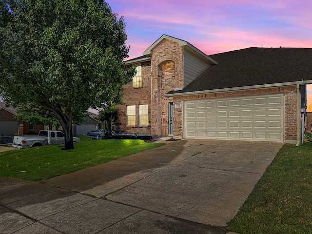 2720 Ocaso Dr, Little Elm, TX 75068 - traditional home with driveway, brick siding, a front lawn, an attached garage, and roof with shingles