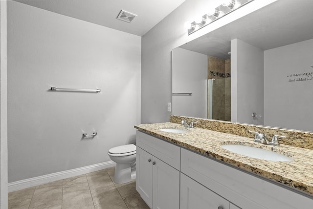 2720 Ocaso Dr, Little Elm, TX 75068 - bathroom with a stall shower, toilet, baseboards, double vanity, and tile patterned flooring