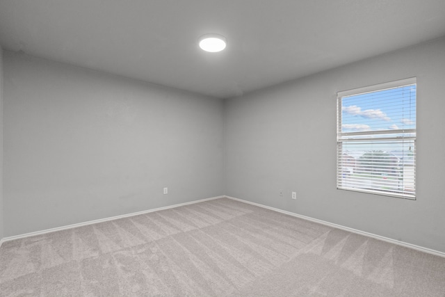 2720 Ocaso Dr, Little Elm, TX 75068 - spare room featuring light colored carpet and baseboards