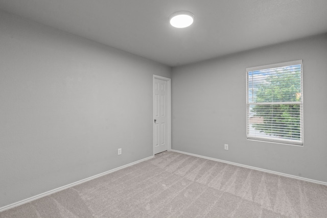 2720 Ocaso Dr, Little Elm, TX 75068 - unfurnished room with light carpet and baseboards