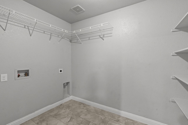 2720 Ocaso Dr, Little Elm, TX 75068 - clothes washing area featuring electric dryer hookup, washer hookup, and baseboards