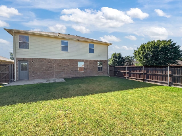 2720 Ocaso Dr, Little Elm, TX 75068 - back of property featuring brick siding and a patio