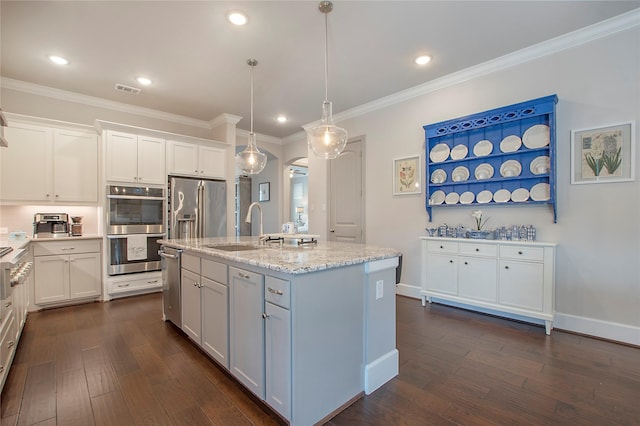 2700 Tremont Blvd, Mckinney, TX 75071 - kitchen with a sink, stainless steel appliances, dark wood-style flooring, light stone counters, and white cabinetry