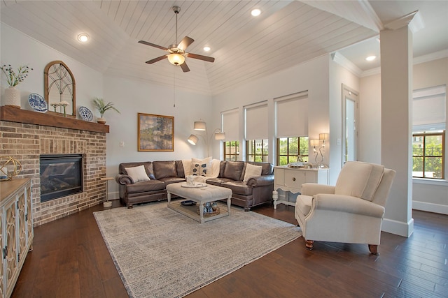 2700 Tremont Blvd, Mckinney, TX 75071 - living room with baseboards, dark wood-style flooring, wooden ceiling, ceiling fan, and a brick fireplace