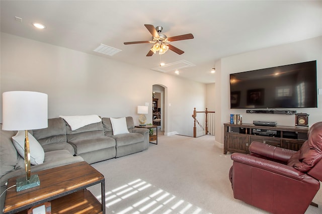 2700 Tremont Blvd, Mckinney, TX 75071 - living area with attic access, a ceiling fan, arched walkways, light colored carpet, and baseboards