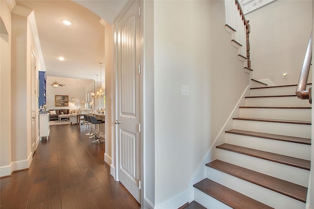 2700 Tremont Blvd, Mckinney, TX 75071 - stairs featuring recessed lighting, wood finished floors, arched walkways, baseboards, and a chandelier