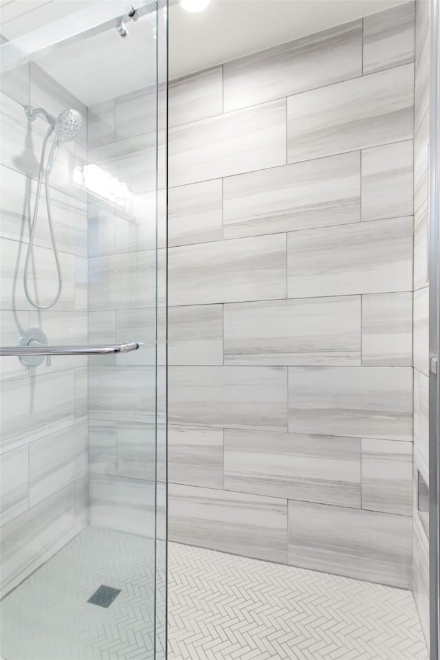 bathroom featuring a shower stall
