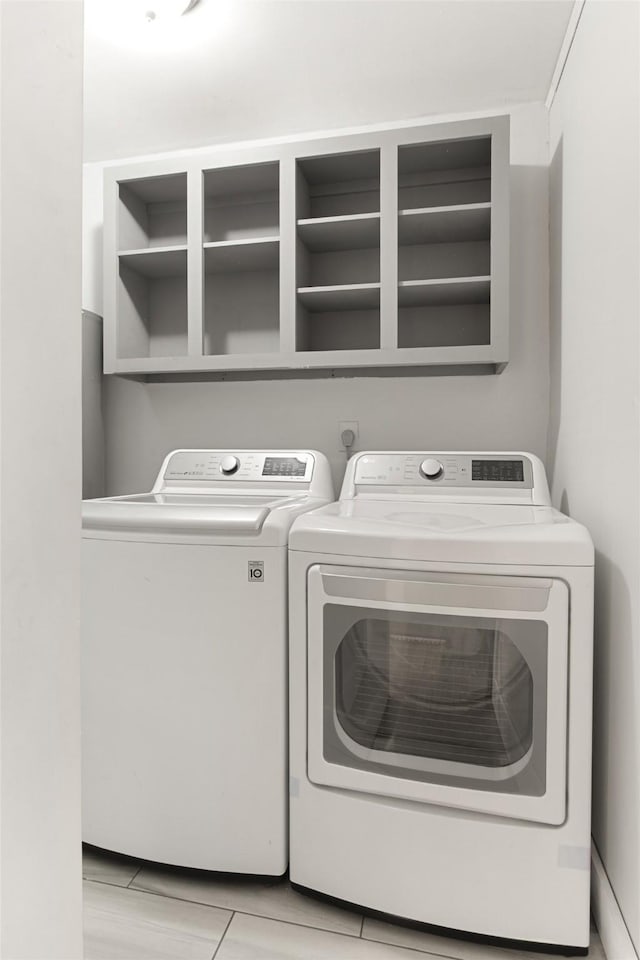 clothes washing area featuring washer and dryer