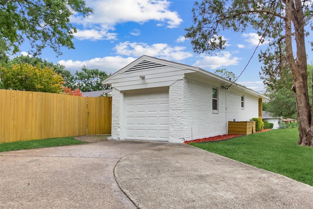 garage with concrete driveway