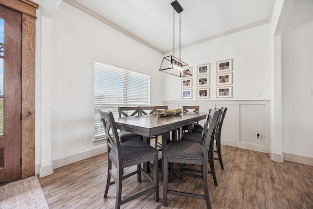 2028 Carrie Ct, Weatherford, TX 76088 - dining space featuring crown molding, wood finished floors, a wainscoted wall, and baseboards