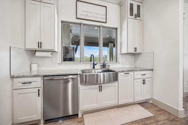 2028 Carrie Ct, Weatherford, TX 76088 - kitchen with dishwasher, a sink, wood finished floors, and white cabinetry