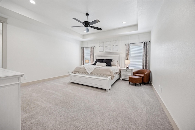 2028 Carrie Ct, Weatherford, TX 76088 - bedroom with light carpet, a raised ceiling, recessed lighting, baseboards, and ceiling fan