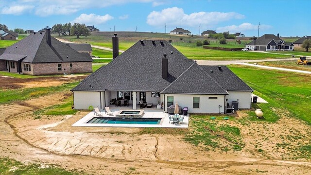 2028 Carrie Ct, Weatherford, TX 76088 - rear view of house with a patio, a yard, a shingled roof, and a residential view