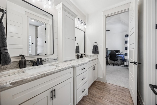 2028 Carrie Ct, Weatherford, TX 76088 - full bathroom featuring double vanity and wood finished floors