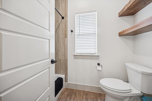 2028 Carrie Ct, Weatherford, TX 76088 - full bathroom featuring toilet, baseboards, and wood finished floors