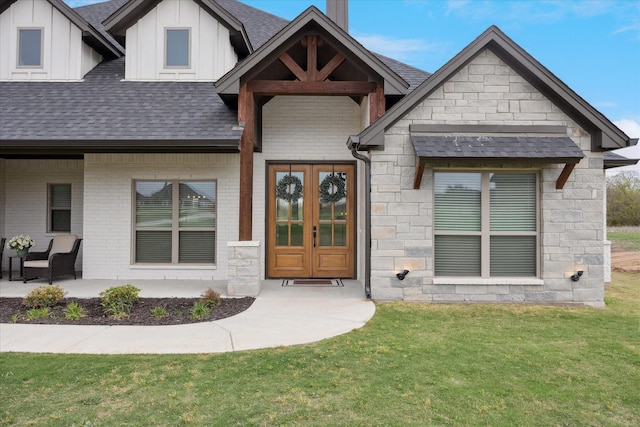 2028 Carrie Ct, Weatherford, TX 76088 - view of front of home with roof with shingles, a front yard, board and batten siding, and stone siding