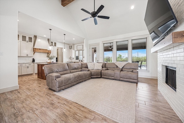 2028 Carrie Ct, Weatherford, TX 76088 - living area with a ceiling fan, light wood-style flooring, a fireplace, high vaulted ceiling, and recessed lighting