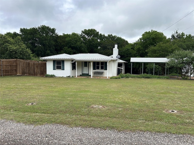 120 One Feather, Whitney, TX 76692 - view of front of house featuring a chimney, a carport, metal roof, and a porch