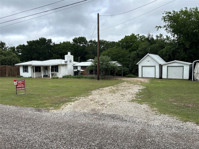 120 One Feather, Whitney, TX 76692 - ranch-style house with a chimney, an outdoor structure, a garage, gravel driveway, and metal roof