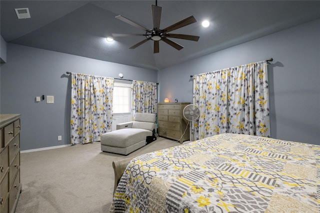 carpeted bedroom with lofted ceiling, baseboards, and a ceiling fan
