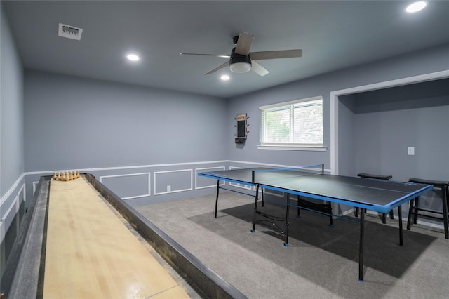 playroom featuring a ceiling fan, wainscoting, recessed lighting, a decorative wall, and carpet floors