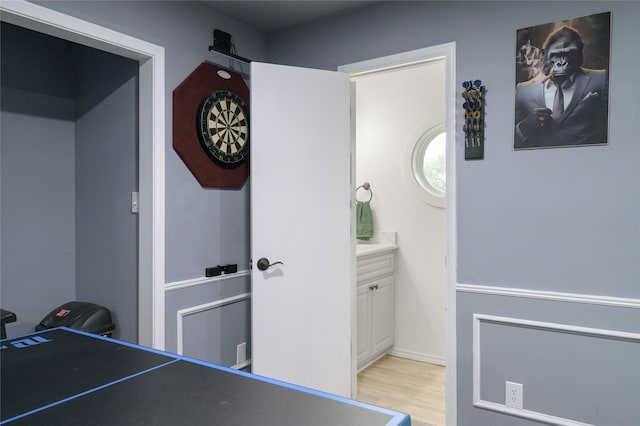 recreation room featuring light wood-style flooring