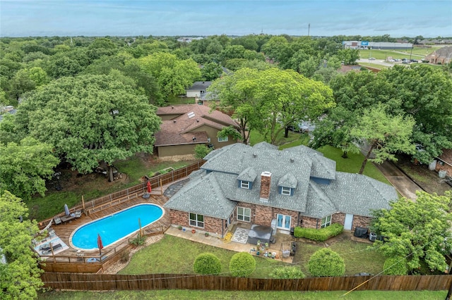 aerial view of property and surrounding area featuring a pool