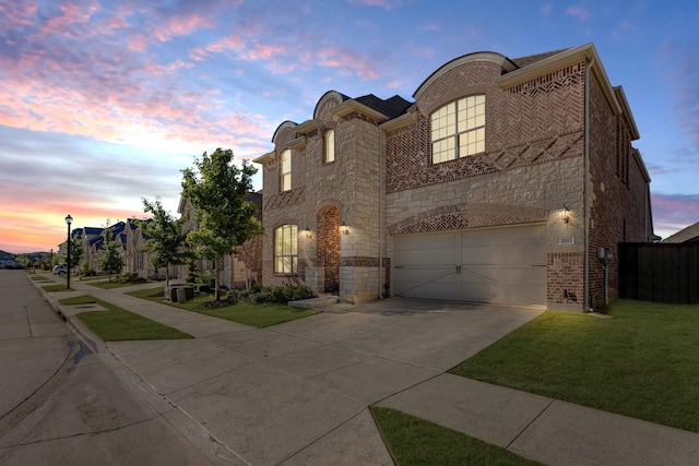 311 Dove Falls Dr, Argyle, TX 76226 - view of front of house with concrete driveway, a garage, brick siding, and stone siding