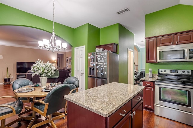 111 Evening Star Cir, Red Oak, TX 75154 - kitchen with stainless steel appliances, open floor plan, a chandelier, a kitchen island, and decorative light fixtures