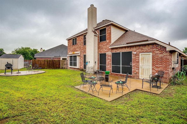 111 Evening Star Cir, Red Oak, TX 75154 - rear view of property featuring a storage shed, a patio area, brick siding, and an outdoor structure